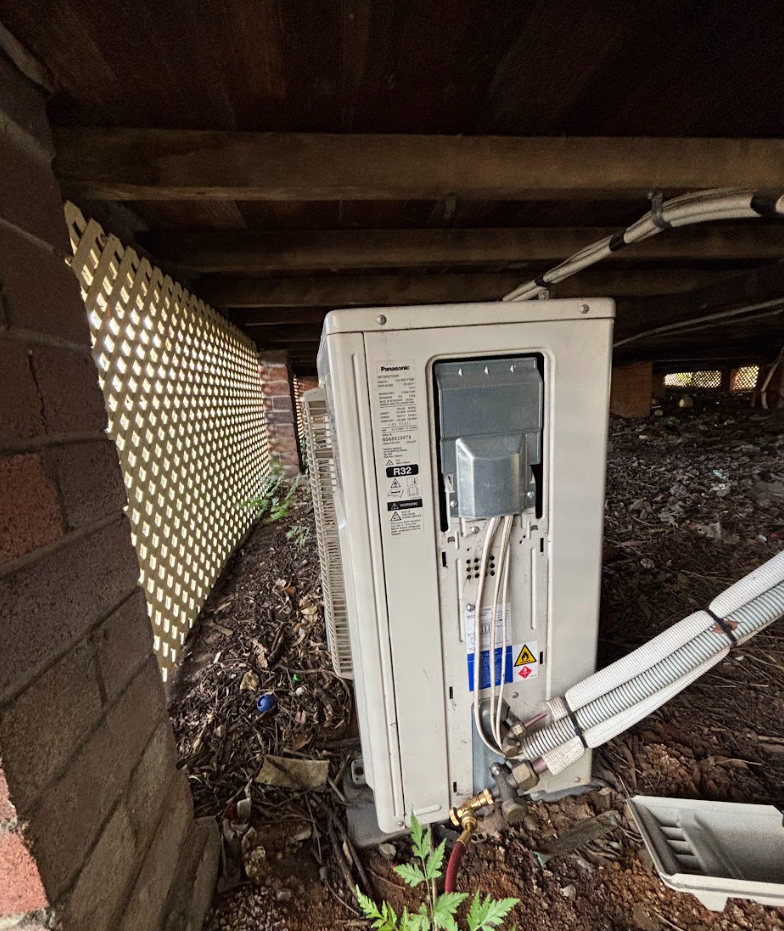 Outdoor air conditioning unit under deck